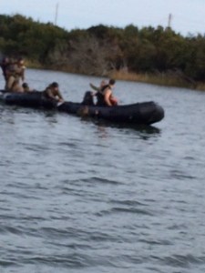 Marines in the water with their weapons training to get back on the bot...wet, cold and tired!